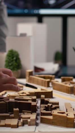 vertical video close up of urban developers showing master plan for residential layout project