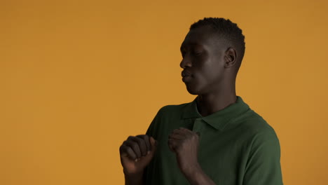 Happy-African-american-man-on-yellow-background.