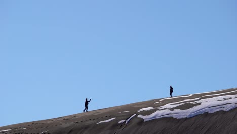 hiking over sand dunes on a sunny day