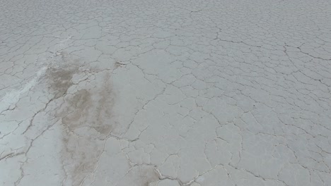 salt ground with cracks in argentina salta, aerial top down view