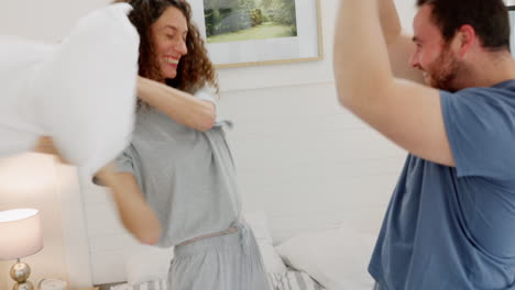 Funny,-laugh-and-pillow-fight-with-a-couple