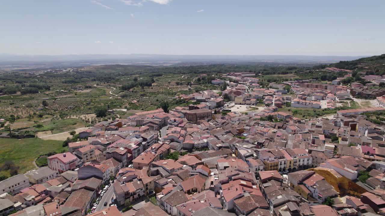 Jara&iacute;z de la Vera aerial view orbiting the scenic Spanish town in North East C&aacute;ceres with colourful red tiled rooftops