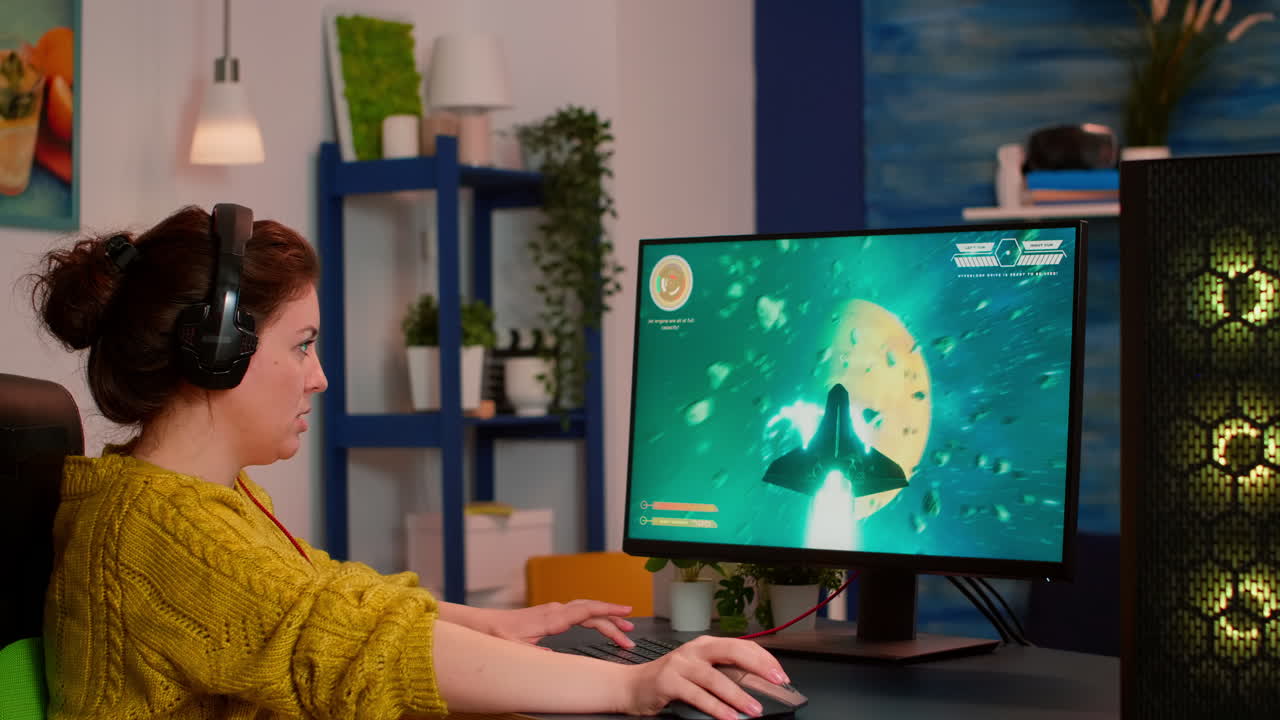Gamer woman with headphones playing space shooter video game