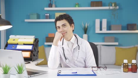 cute boy looking at camera dressed as doctor at home. future doctor. imagination.