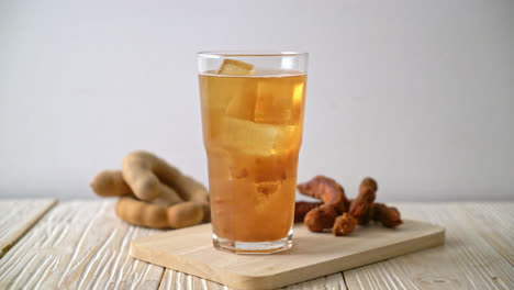 delicious sweet drink tamarind juice and ice cube - healthy drink style