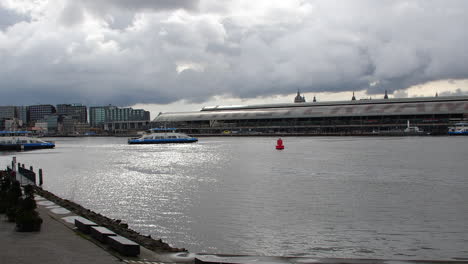 Ferry-crossing-water-in-Amsterdam-on-cloudy-day