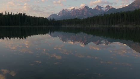 mountain range reflection in herbert lake early morning calm lake waters