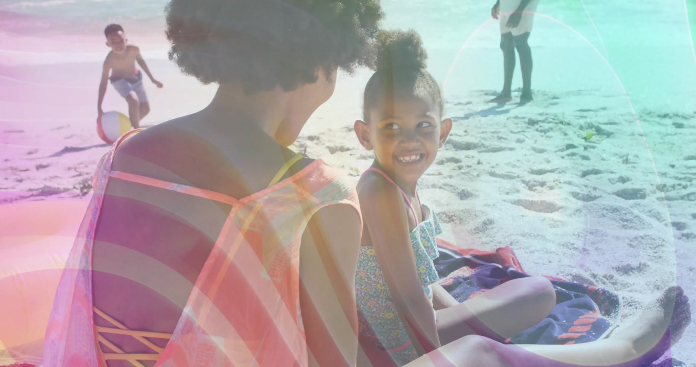 Mother scooping sunscreen and spreading on daughter's shoulders at beach for skin protection