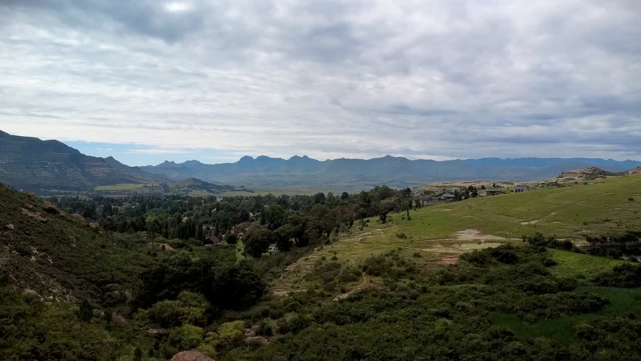 Rising drone shot capturing the scenic beauty of Clarens, Free State, with rolling hills and greenery. Perfect for nature, travel, and adventure projects