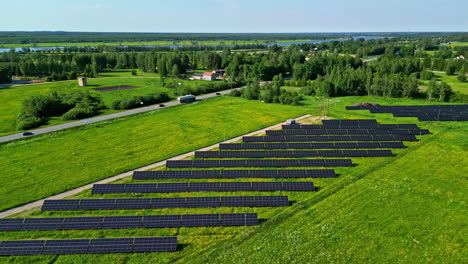 solar panel energy farm in the european countryside - aerial push in