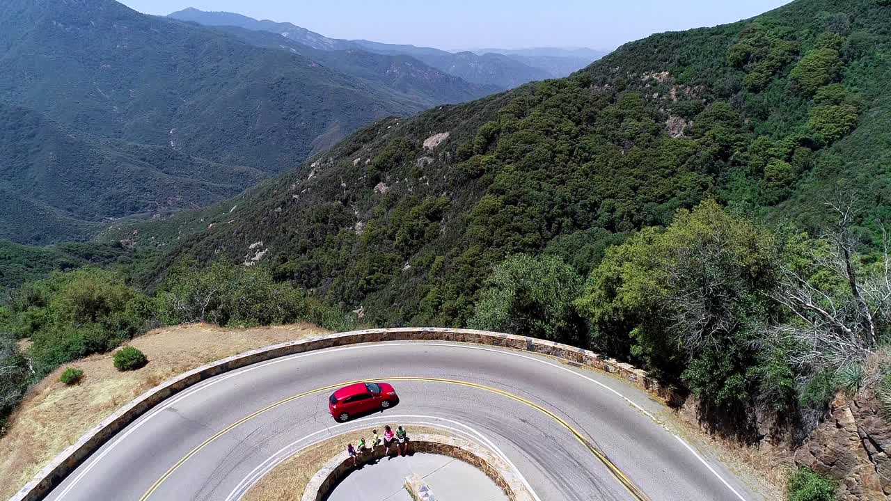 Happy family at the road stop in national sequoia forest