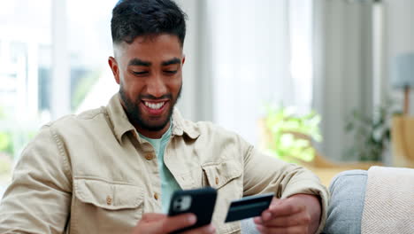 Happy-man,-phone-and-credit-card-on-sofa