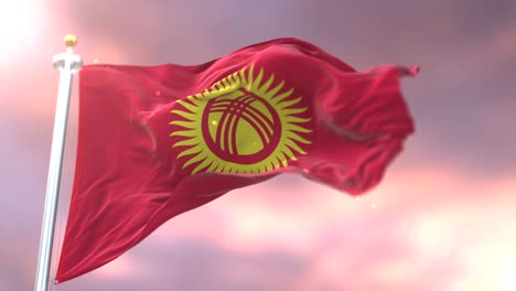flag of kyrgyzstan waving at wind at sunset in slow, loop