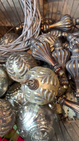 christmas ornaments and decor in a basket