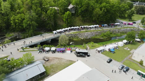 view from above of booths and people at the dogwood festival by the sager creek in siloam springs, arkansas