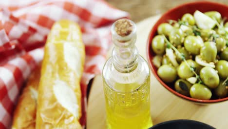 bread, olive oil and olive tapas on table