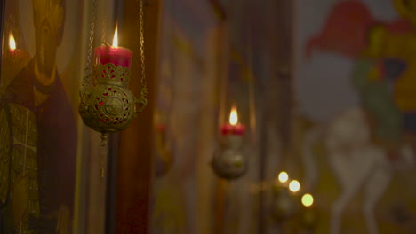 a 12th-century georgian orthodox church, a view of candles in the lurji monastery, or "blue church", in tbilisi georgia