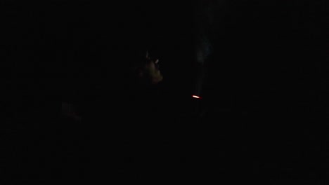 person with a flashlight in a dark area