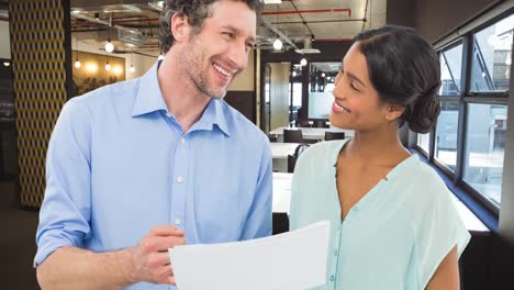 Animation-of-smiling-diverse-business-people-discussing-in-office