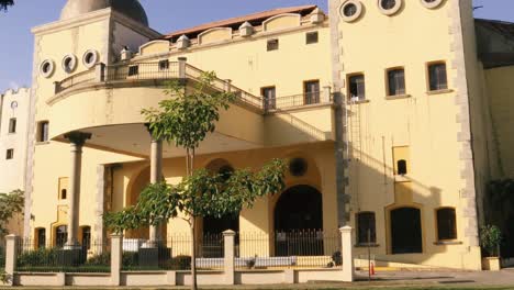 Neglected-facade-of-former-Figali-convention-center-with-gorgeous-classical-architecture-displaying-the-hispanic-influence-in-the-local-culture,-part-of-the-exclusive-real-estate-in-Amador,-Panama