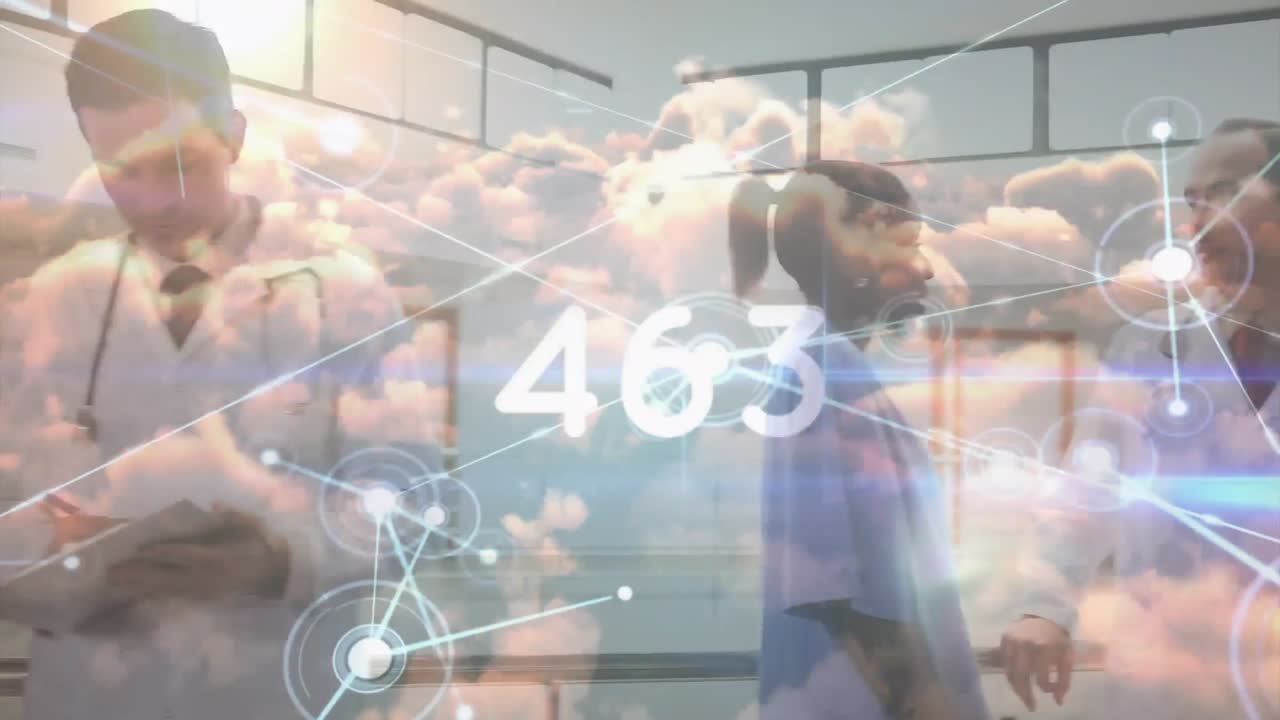 un grupo de trabajadores de la salud están reunidos en un pasillo del hospital, con un médico sosteniendo un clipboard.