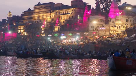 dashashwamedh ghat seen from the sacred ganges river at dusk in varanasi, uttar pradesh, india