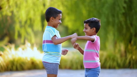 two young boys playing a game outdoors