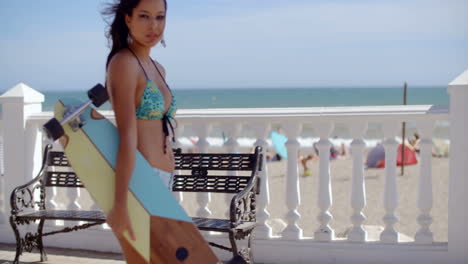 sexy gorgeous woman on a beachfront promenade