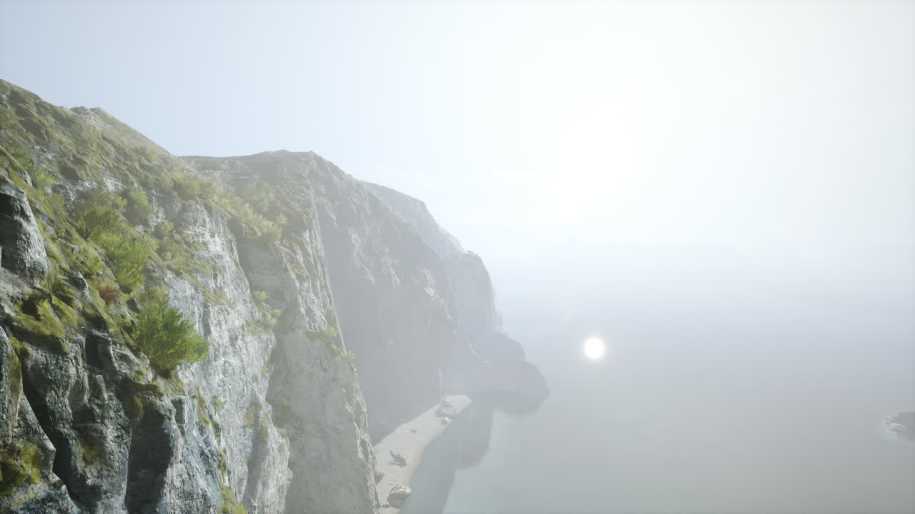 바다 위 에 해 가 지는 바위 가 있는 해안선 의 멋진 풍경