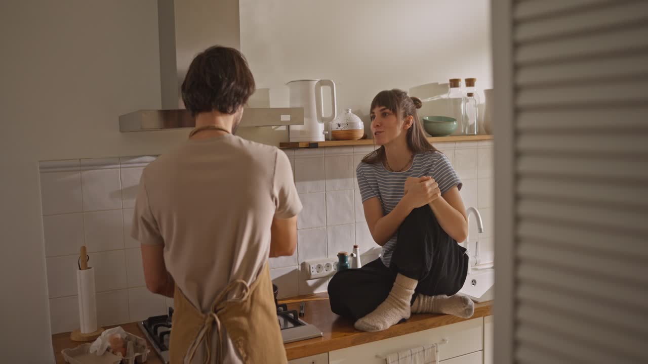 A Couple Cooking Together in Their Kitchen