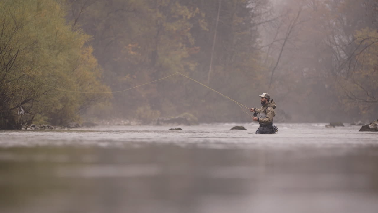 Fly Fishing in a Misty Autumn River