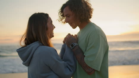 couple enjoying sunset at the beach