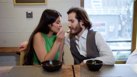 young couple eating together