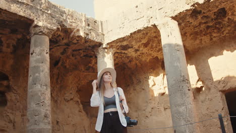 woman exploring ancient ruins