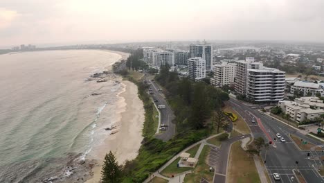 panorama of mooloolaba beach with oceanfront apartments and coastal road at sunshine coast region, queensland, australia