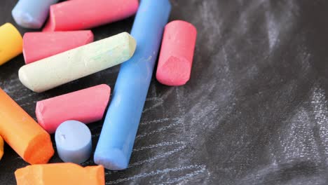 assorted colored chalk on a blackboard