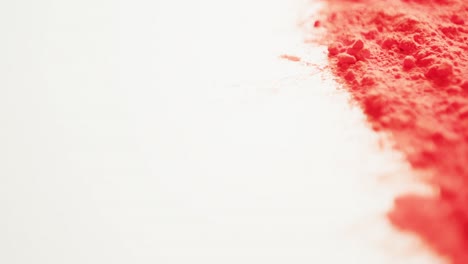 video of red coloured powder with copy space on white background