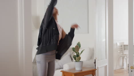 young woman dancer having fun practicing cool hip hop dance moves at home celebrating enjoying dancing 4k