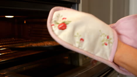 woman opening the oven