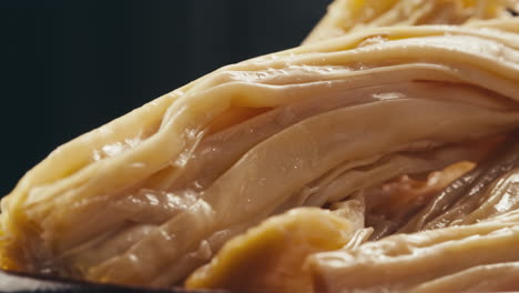Fermented soy food Fuzhou, Tofu skin yuba sticks or Fuzhu on plate. Healthy asian soy food, Korean and Chinese cuisine.