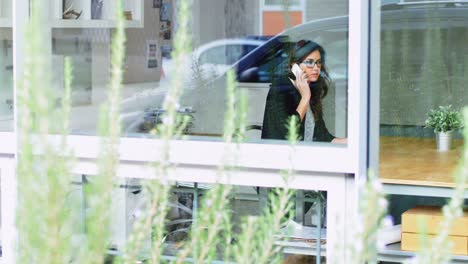 female executive talking on mobile phone