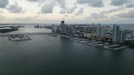 aerial high angle footage of miami south beach bridge avenue connecting to downtown