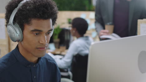 multi ethnic business people brainstorming caucasian businessman boss sharing ideas pointing at screen showing support teaching colleague discussing project in office workplace