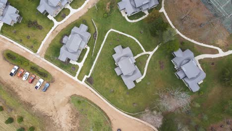 real estate concept - aerial birds eye view above big and fancy houses