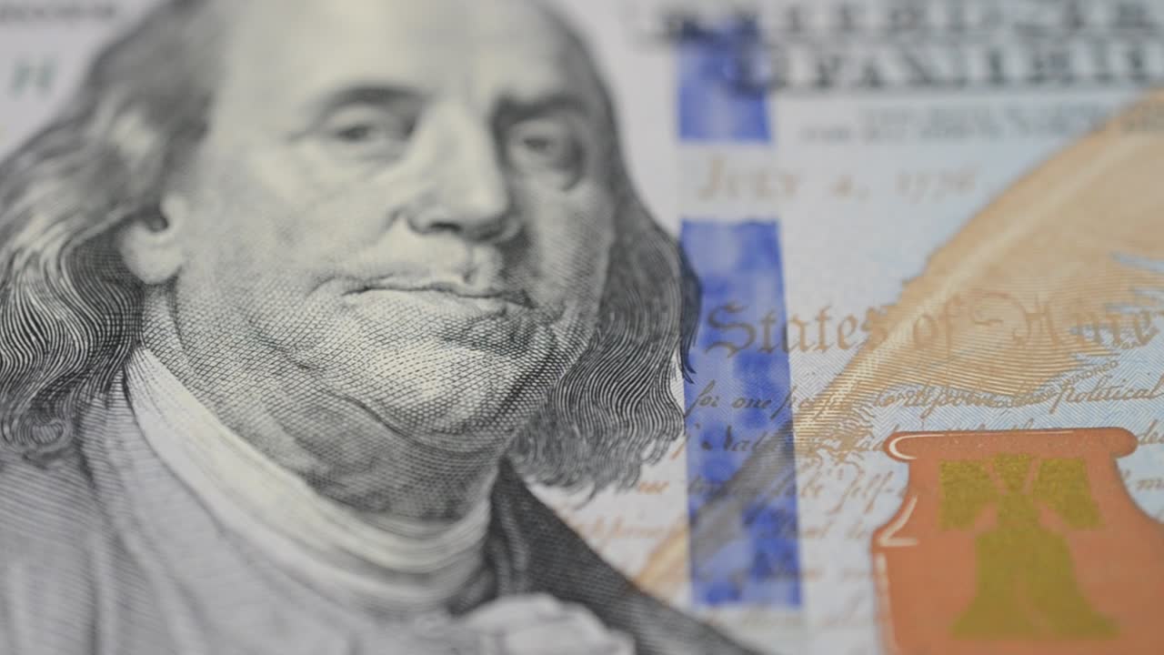 Note of 100 dollars. Shooting of money
