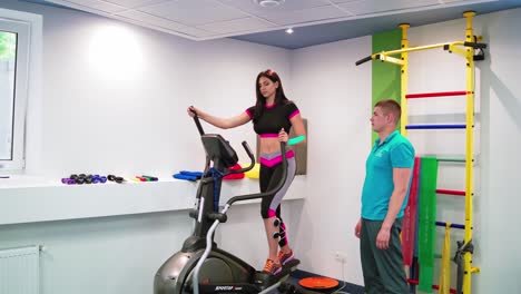 young woman during rehabilitation. patient at the physiotherapy doing physical exercises with therapist