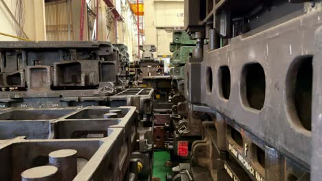 stack of heavy iron mold of press machine on the factory.