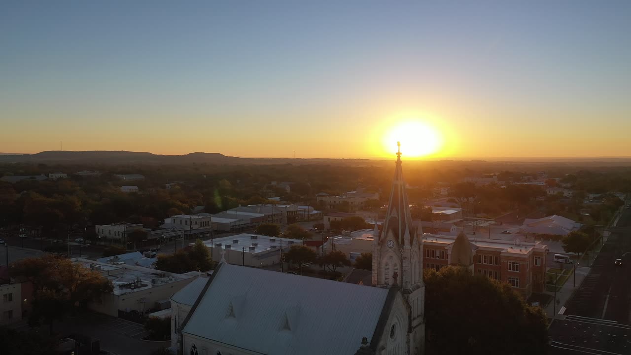 Saint Mary's Catholic Church backlit by stunning sunset, Fredericksburg Texas