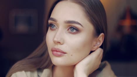 beautiful young girl with blue eyes looking tenderly at camera