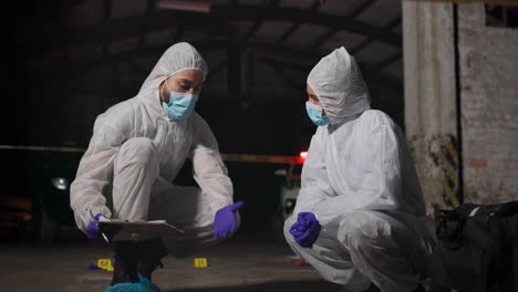 forensic investigators at a crime scene